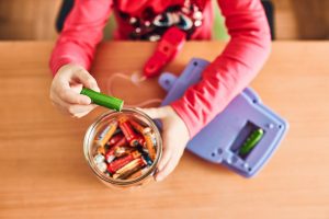 Little,Girl,Removing,Used,Batteries,From,Toy,And,Putting,Into